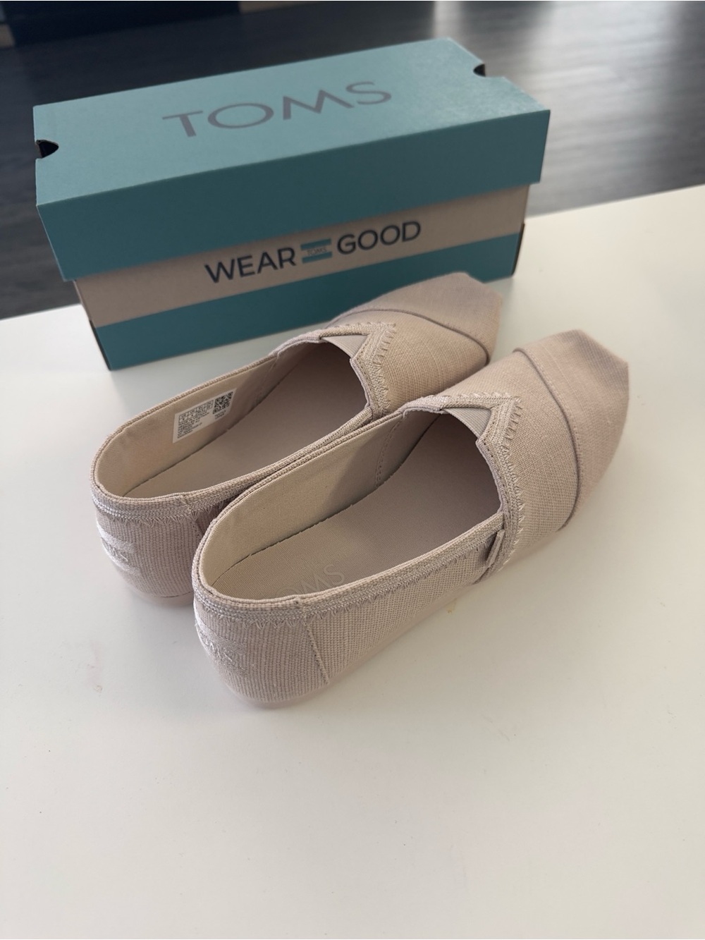 TOMS Women's Classic Canvas Slip-On Flats in Tan